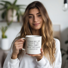 Load image into Gallery viewer, Enough_Bullshit_20_oz_Mug_Model_Holding_LH_Mockup.png