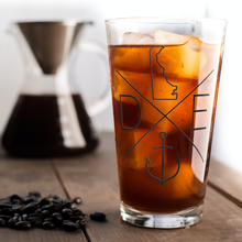 Load image into Gallery viewer, Compass_DE_Pint_Glass_Pint_Glass_Iced_Coffee_Mockup.png
