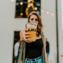 Load image into Gallery viewer, Delaware_Home_Pint_Glass_Pint_Glass_Model_Lifestyle_Mockup.png
